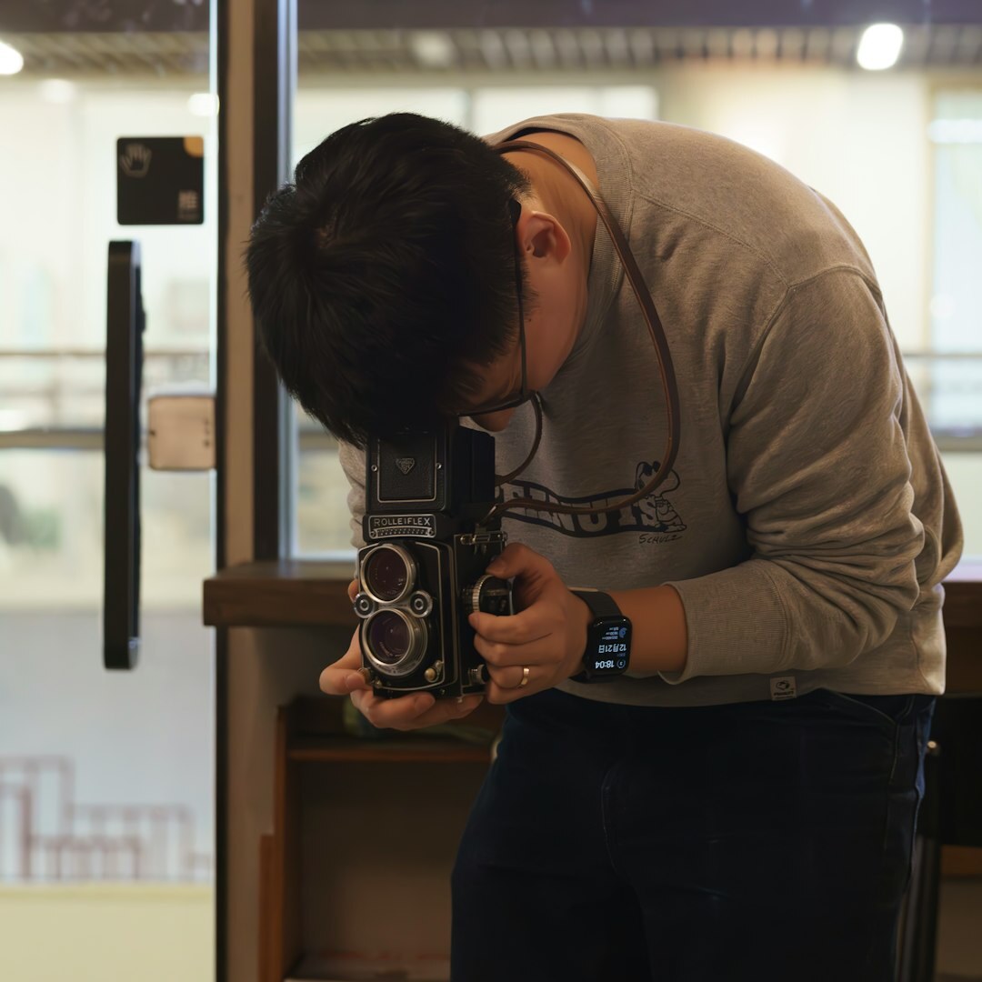 Finnish man in his 40s working as a camera operator instructor