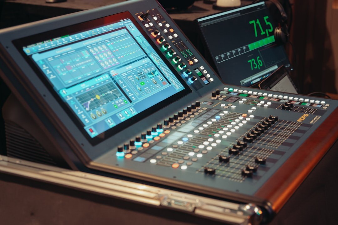 Television control room with multiple video monitors and a switcher panel